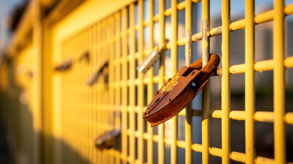 Yellow bridge with rusted lock on 